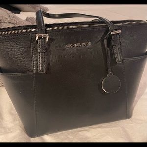 Used but still in great condition Michael Kors purse!